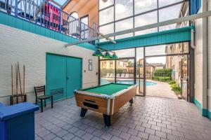 a pool table on a patio in a building at Country Inn & Suites by Radisson, Muskegon, MI in Muskegon