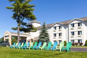 a row of chairs in front of a building at Sleep Inn & Suites Bay View Acme - Traverse City in Traverse City