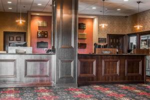 a lobby with a counter in at Shoreline Inn & Conference Center, Ascend Hotel Collection in Muskegon