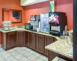 a kitchen with a coffee maker and a refrigerator at Quality Inn Lakeville in Lakeville