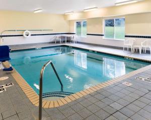 a large pool with blue water in a building at Quality Inn Lakeville North in Lakeville