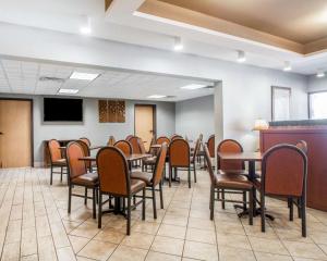 a conference room with tables and chairs and a tv at Quality Inn South Springfield in Springfield