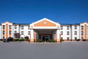 a large building with a parking lot in front of it at Quality Inn & Suites Arnold in Arnold