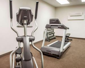 a gym with two exercise bikes and a treadmill at Sleep Inn & Suites Lake of the Ozarks in Camdenton