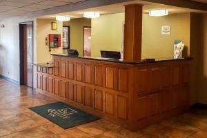 a lobby with a reception desk in a building at Quality Inn in Ozark