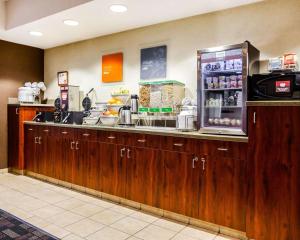a kitchen with a counter with a refrigerator at Comfort Suites Independence - Kansas City in Independence