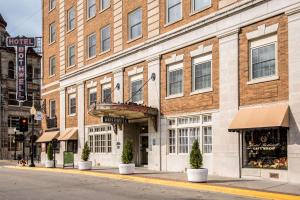 a large brick building on a city street at Hotel Bothwell Sedalia Central District, Ascend Hotel Collection in Sedalia