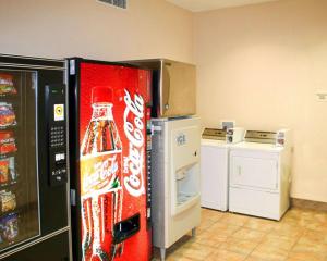 a cocacola soda vending machine in a kitchen at Quality Inn & Suites Bethany in Bethany +14 photos