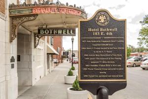 a sign in front of a hotel building at Hotel Bothwell Sedalia Central District, Ascend Hotel Collection in Sedalia
