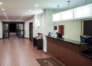 a lobby of a hospital with a reception counter at Sleep Inn & Suites Indoor Waterpark in Liberty