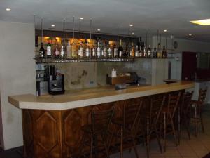 a kitchen with a bar and a counter top at Hotel Adler in Augsburg