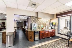 a large kitchen with a counter and a window at Quality Inn in West Plains