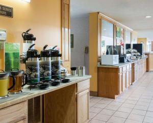 a kitchen with a counter with pots and pans at Quality Inn Robinsonville in Tunica Resorts