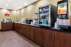 a convenience store counter with a drink dispenser at Quality Inn in Batesville