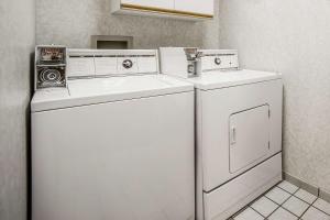 a laundry room with a washer and dryer at Yellowstone River Inn & Suites in Livingston