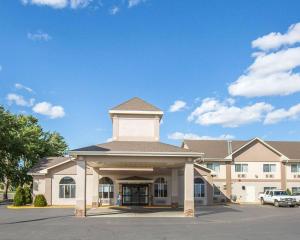 a large building with a tower on top of it at FairBridge Inn & Suites Glendive in Glendive