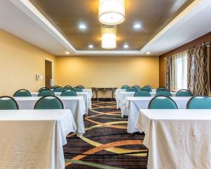 a room filled with tables and chairs with white table cloths at Quality Inn Lincolnton in Lincolnton