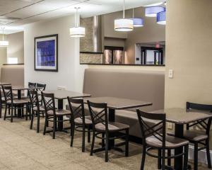 a row of tables and chairs in a waiting room at Comfort Suites University - Research Park in Charlotte