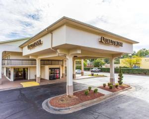 a front view of a building with a store at Quality Inn University in Winston-Salem