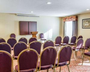 a room with rows of chairs and a podium at Quality Inn Raleigh Downtown in Raleigh