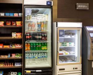 an open refrigerator in a store with drinks at Comfort Suites Charlotte Airport in Charlotte