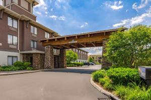 a building with a bridge in the middle of a street at Sleep Inn Boone University Area in Boone