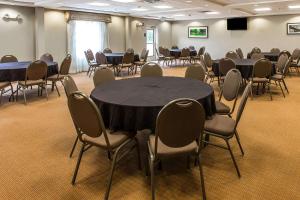 a conference room with tables and chairs in it at Sleep Inn & Suites Mount Olive North in Mount Olive