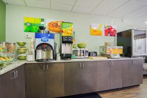 a kitchen with a counter with a coffee maker at Quality Inn Raeford in Raeford