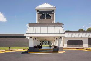 a large building with a clock tower on top at Quality Inn & Suites University Area in Charlotte