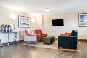 a waiting room with chairs and a flat screen tv at Comfort Inn Dickinson in Dickinson