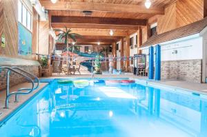 a swimming pool in a house with a indoor swimming pool at Comfort Inn Dickinson in Dickinson