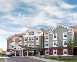 a rendering of the exterior of a hotel at MainStay Suites Minot in Minot