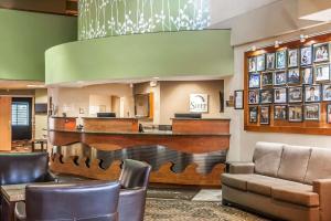 a lobby with a bar in a hotel at Sleep Inn & Suites Conference Center and Water Park in Minot