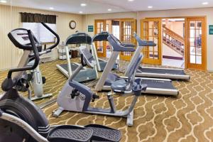 a gym with several treadmills and cardio machines at Quality Inn in North Platte