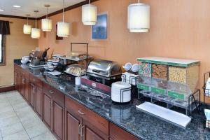a kitchen with a counter with some food at Quality Inn in North Platte