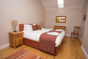 Letto o letti in una camera di Decoy Country Cottages