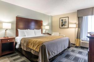 a hotel room with a bed and a window at Comfort Inn SW Omaha I-80 in Omaha +26 photos