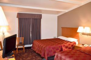 Postel nebo postele na pokoji v ubytování MHO Hotel Bordentown