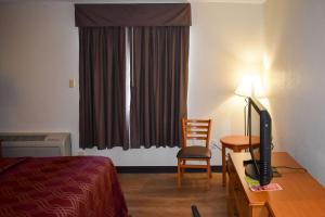 Postel nebo postele na pokoji v ubytování MHO Hotel Bordentown