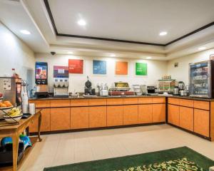 a large kitchen with a counter in a restaurant at Quality Inn in Ashland
