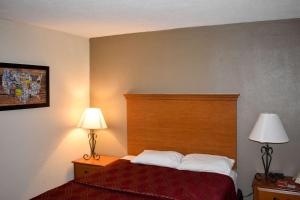 Postel nebo postele na pokoji v ubytování MHO Hotel Bordentown