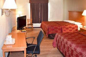 Postel nebo postele na pokoji v ubytování MHO Hotel Bordentown