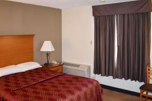Postel nebo postele na pokoji v ubytování MHO Hotel Bordentown