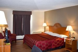 Postel nebo postele na pokoji v ubytování MHO Hotel Bordentown