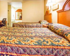 a hotel room with two beds in a room at Rodeway Inn Mount Laurel Hwy 73 in Mount Laurel