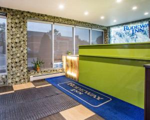 a room with a green and blue ramp in a building at Rodeway Inn in Belleville