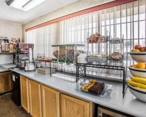 a kitchen with a bunch of food on a counter at Rodeway Inn Elko Downtown Area in Elko