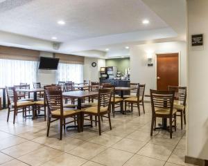 a large dining room with tables and chairs at Sleep Inn & Suites Queensbury - Lake George in Queensbury