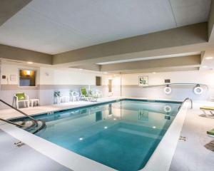 a large swimming pool in a hotel room at Sleep Inn & Suites Queensbury - Lake George in Queensbury