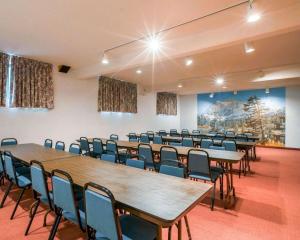 a conference room with tables and chairs in it at Rodeway Inn Lake Placid South in Lake Placid